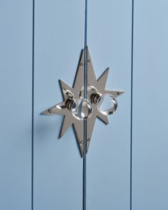 a metal door handle on a blue door