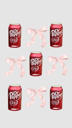 six cans of dr pepper are tied with white ribbon and bow on gray background,