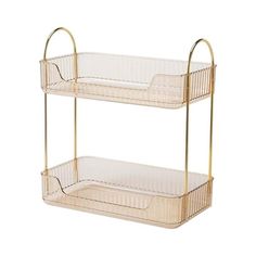 two tiered trays with gold handles on each side, one is empty and the other has a basket