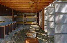 the inside of a house with stone floors and walls