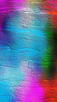 a multicolored image of the surface of a wall with paint chipped on it