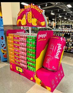 a display in a grocery store filled with lots of different flavored drinks and snacks