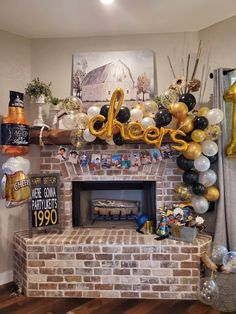 a fireplace decorated with balloons and streamers for a new year's eve party