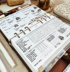 an open planner sitting on top of a table