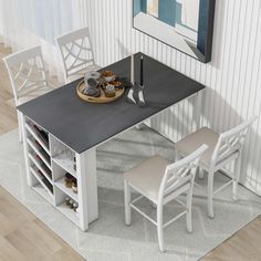 a dining table with four chairs and a wine rack in the middle on a rug