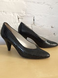 "snakeskin in black covered heel soft pointed toe cone heel the size at the bottom is almost worn (I'm a 7.5 and I can't put them on) so this makes them a 6.5 9\" inside foot bed, 3\" heel we combine shipping, add to your cart before checkout for best fit, compare measurements to your clothing please email with any questions or concerns about fabrics we love styling questions! smoke and pet free store. thanks for stopping note: all items were acquired weeks/months before and are handled with gloves" Black Vintage Heeled Boots With Snip Toe, Snake Print Heels With Pointed Toe For Evening, Evening Heels With Snake Print And Pointed Toe, Formal Snake Print Heels With Pointed Toe, Vintage Slip-on Heels Medium Width, Vintage Black Heels With Leather Sole, Vintage Slip-on Heels With Removable Insole, Snake Print Heels With Pointed Toe, Snake Print Leather Heels Medium Width