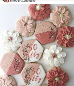 decorated cookies are arranged in the shape of flowers