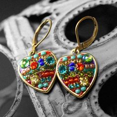 These handmade heart earrings are electroplated with 24 K gold and embellished with rainbow Swarovski crystal and glass beads. These bright and colorful earrings are romantic and quirky and add a pop of color to any outfit. These handmade earrings make a great gift for anniversaries, holidays or Valentine's day. Earring Length: .5 inch Item Number: S6726 Professionally crafted in our studio from Swarovski crystals, glass beads, and brass electroplated with 24 K Gold. +Jewelry will be shipped wra Unique Gold Earrings For Valentine's Day, Unique Gold Heart-shaped Earrings, Unique Gold Heart Earrings, Nickel-free Multicolor Heart Earrings For Jewelry Making, Gold Beaded Dangle Heart Earrings, Gold Beaded Heart Earrings For Gift, Micro Mosaic Jewelry, Handmade Heart, Gold Gifts