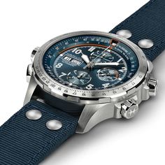 This aviation-inspired men's chronograph watch from the Khaki collection by Hamilton is packed with function and style. From the reverse crown to the airspeed indicator and cross-wind scale on the blue dial, the 45mm stainless steel case presents the user with a day-date window, luminous indices and hands and distinctive chronograph dials that are both elegant and easy-to-read. The automatic movement is protected by a sapphire crystal and visible through the transparent case back. A blue fabric strap secures the watch, which is water-resistant to 100 meters. Hamilton Watch Khaki, Life Of Adventure, Tactical Watch, Hamilton Khaki, Fancy Watches, Hamilton Watch, Blue Cases, Chronograph Watch Men, Man Style