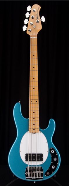 a blue and white guitar sitting on top of a table