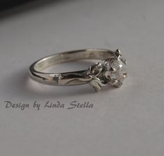 Sterling Flower Engagement Ring stone in 6 prong by LStellaJewelry, $69.50 Sterling Silver Crystal Birthstone Ring For Wedding, Heirloom Crystal Birthstone Ring For Wedding, Wedding Birthstone Ring In Diamond White Sterling Silver, Diamond White Sterling Silver Birthstone Wedding Ring, Diamond White Sterling Silver Wedding Birthstone Ring, Wedding Sterling Silver Diamond White Birthstone Ring, Diamond White Sterling Silver Birthstone Ring For Wedding, Wedding Rings With Birthstone In Diamond White, Diamond White Wedding Rings With Birthstone