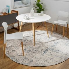 a white table and chairs in a room