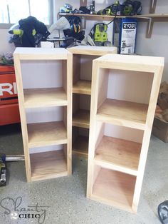 two wooden shelves sitting next to each other in a room