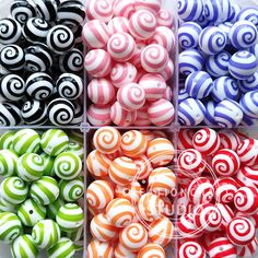 there are many different colored candies in the box together and they look like spirals