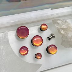 "WELCOME TO PINK ALIEN BABE YOUR ONE STOP SHOP FOR ALL THE CUTEST PLUGS AND ACCESSORIES IN THE GALAXY ⭐️ 🎀This is a listing for ONE PAIR of iridescent pink/orange/yellow color changing single flare with o-ring silver steel ear plugs in your choice of size. 👽💕 Sizes available: 8g 3mm, 6g 4mm, 4g 5mm, 2g 6mm, 0g 8mm, 00g 10mm, 1/2\" 12mm, 9/16\" 14mm, 5/8\" 16mm 🌈 Your new jewelry will come adorably packaged in a decorative bag! 🌙 Don't forget to follow @PinkALIENbabe on Instagram to stay up 18mm Stretched Ears, 00 Gauges In Ear, 00g Stretched Ears, Small Ear Gauges, Pretty Gauges, 0g Plugs, 00g Plugs, Gauge Jewelry, Earrings Gauges