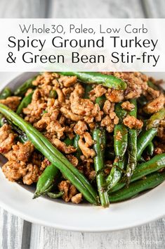 green bean stir fry on a white plate with the words whole 30 pale low carb spicy ground turkey and green bean stir fry