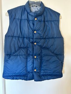 "West Cal 45 - vintage Lee brand puffer vest, men's size medium* Vest has no tags, info from similar listing Snap buttons with West Cal 45 logo Two front pockets Stand up collar A classic puffer vest! In very good vintage condition, no flaws From a smoke free home *No size tag, please review measurements Size closest to men's medium Measurements approx: Flat across chest 20.75\" Length 24.5\" 💻Please note colors may vary depending on computer monitor / personal phone screen resolution" Vest Outfits, Puffer Vest, Puffer, Gender Neutral, Bathing Beauties, Adult Outfits, Resolution, Summer Dresses, Size Medium