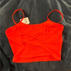 Deep Neon Orange Never Worn! I Bought Grey And Orange And Wore The Grey Instead I Know I Have A Lot Of Listings But Please Take A Second To Scroll Through And Make A Bundle! I Offer More Discounts For Bundles! Strappy Tops For Spring, Fitted Strappy Beach Tops, Orange Crop Top For Summer Night Out, Orange Crop Top For Summer Nights, Summer Party Top With Built-in Bra, Orange Sleeveless Top For Night Out, Casual Strappy Crop Top For Party, Orange Stretch Top With Built-in Bra, Orange Fitted Tank Top For Vacation