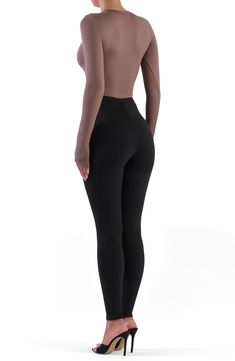 Sculpt your silhouette with this stretchy bodysuit cut from soft-to-the-touch fabric for a second-skin feel. Crewneck Long sleeves 88% polyester, 12% spandex
 Machine wash, line dry
 Imported Model stats: 5'10", 32" bust, 25" waist, 36" hip. Model is wearing size Small. High Cut Stretch Solid Color Leotard, Stretch High Cut Leotard, High Stretch Solid Bodysuit For Dancewear, High-cut Stretch Solid Color Leotard, High Stretch Full Length Elastane Unitard, Stretch High Cut Shapewear Bodysuit, High Stretch High Waist Shapewear Bodysuit, High Stretch Shapewear Unitard, Second-skin High-cut Leg Shapewear Bodysuit