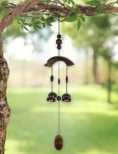 a wind chime hanging from a tree branch