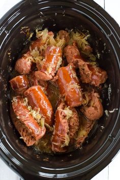 the crock pot is filled with cooked meat and vegetables