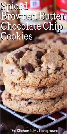 chocolate chip cookies stacked on top of each other with the words spiced browned butter chocolate chip cookies