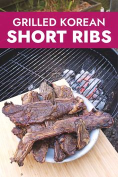 grilled korean short ribs on the grill with text overlay that reads grilled korean short ribs