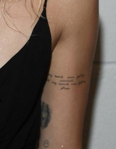 a woman with a tattoo on her arm