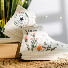 Flower embroidered Converse High Top shoes for weddings are inspired by the gorgeous bridal bouquet. With many years of experience embroidering wedding shoes for the bride, this time I was really happy to receive a personalized canvas sneaker embroidery design for a very special guest. They sent me wedding photos and sweet bouquets of flowers. I love them and also love this custom embroidered item. If you also need a pair of Converse Wedding Shoes or a pair of Vans Shoes for the bride, please message me with wedding photos. I will design and embroider a special pair of wedding shoes for your wedding anniversary. * Product details: ''Converse Hight Tops hand embroidered Bridal Flowers, Wedding Flowers Embroidered Shoes, Bridal Flowers Embroidered Sneaker'' Shoe Type: Converse High Tops 1970 Wedding Day Converse, Sneaker Embroidery, Wedding Converse Bride, Embroidered Wedding Shoes, Wedding Trainers, Wedding Sneakers For Bride, Shoes For The Bride, Bride Converse, Embroidery Converse