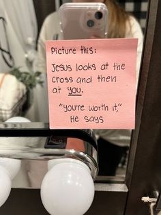 a note attached to a mirror that says, you are worth it he says'picture this jesus looks at the cross and then at you