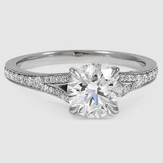 a white gold engagement ring with pave set diamonds