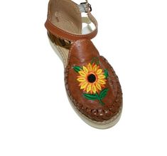 Authentic handmade Mexican Huarache Sandals Made in Mexico Huaraches are handmade with leather uppers with flowers embroidery Rubber outer soles The inner sole is lined with authentic leather. Brown Hand Tooled Huarache Sandals For Spring, Brown Hand-tooled Huarache Sandals For Spring, Spring Brown Hand Tooled Huarache Sandals, Traditional Leather Huaraches For Spring, Summer Embroidered Leather Huarache Sandals, Embroidered Leather Huarache Sandals For Festival, Embroidered Leather Huarache Sandals For Summer, Leather Embroidered Huarache Sandals For Festivals, Embroidered Leather Open Toe Huaraches