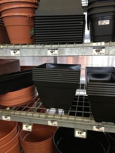 pots and pans on shelves in a store