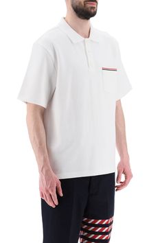 Thom Browne polo shirt crafted in solid pure cotton jersey. Design with spread collar and three-button half placket featuring a chest patch pocket decorated with tricolor band, dropped back hem with buttoned slits finished with tricolor grosgrain. Embellished with tricolor loop tab on the upper-back. Relaxed fit. The model is 187 cm tall and wears size 3 Thom Browne. Size Info MONCLER Color Detail White Made In Japan Material 100% CO Season One spring Season Two summer Product clothing Brand Tho Latest Fashion Design, Polo Shirt White, Cotton Polo Shirt, Jersey Design, Cotton Polo, Thom Browne, Shirt Sale, Tri Color, Fashion Collection