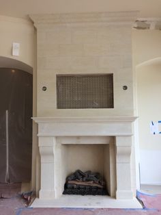 an unfinished fireplace in the middle of a room