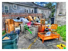 a yard full of furniture and junk in front of a house with an overcast sky