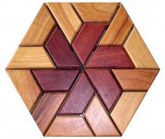 a close up of a wooden object with many different colored squares in the shape of hexagons