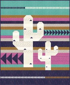 a rug with a cactus and arrows on it