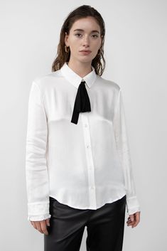 Introducing the SATEEN BOW SHIRT from The Pop Up Shop. This stylish and innovative shirt is perfect for any occasion. Crafted from a luxurious sateen fabric, it features a classic bow detail at the neckline for a touch of sophistication. The long sleeves and relaxed fit make it comfortable to wear all day long. The SATEEN BOW SHIRT is a must-have for any wardrobe. It's perfect for work, special occasions, or just a night out. The timeless design and quality fabric make it a timeless piece that y Bow Shirt, Bow Shirts, Pop Up Shop, Bow Detail, Timeless Pieces, Timeless Design, Quality Fabric, Pop Up, Must Haves