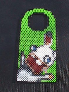 a cell phone case made out of perler beads with an image of a dog on it