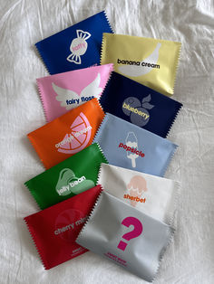 six different types of candy bags on a white sheet with question mark in the middle