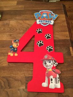 the number four is made up of paw patrol and paw patrol characters on red paper