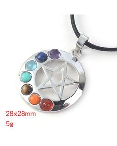 a pentagramil pendant with seven chakras on it