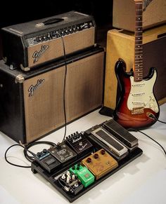 an electric guitar, amp and other musical equipment