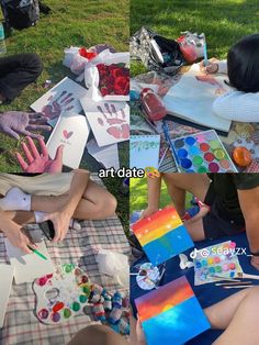 people sitting on the grass painting with their hands