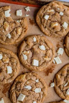 chocolate chip cookies with white marshmallows on a baking sheet ready to be baked