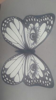 two white butterflies with black spots on their wings