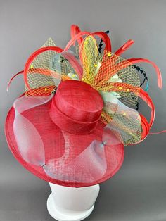 Red Feathered Fascinator For Kentucky Derby, Red Feathered Hat For Races, Red Feathered Costume Hat For Races, Red Feathered Fascinator Hat, Red Feathered Hat Fascinator, Red Curved Brim Fascinator For Garden Party, Red Summer Fascinator For Garden Party, Red Feathered Costume Hats And Headpieces For Summer, Red Adjustable Fascinator For Garden Party