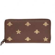 The Gucci Bee Star Zip Around Wallet In Brown Is Crafted In Brown, Calfskin Pebbled Leather. The Surface Is Embellished With Embossed Pattern With Signature Motif Of Bee, Logo And Star In Gold-Tone. The Zip Around Wallet Features 3 Bills Compartments, 1 Snap-Fastened Coins Pocket And 12 Card Slots Inside. Gucci Bee Star Zip Around Wallet In Brown Metallic Gold Accents 100% Pebbled Calfskin Leather Zip Around Wallet Bee And Star Print Pattern 3 Bill Compartments 1 Snap-Fastened Coins Pocket 12 Ca Gucci Brown Formal Wallet, Formal Brown Gucci Wallet, Luxury Brown Gucci Wallet, Designer Brown Wallet For Evening, Gucci Bee, Bee Logo, Embossed Pattern, Gucci Crossbody, Gucci Monogram