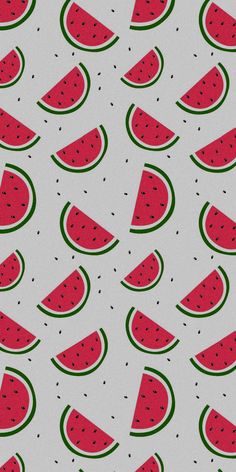 watermelon slices on a white background with green and red designs in the middle